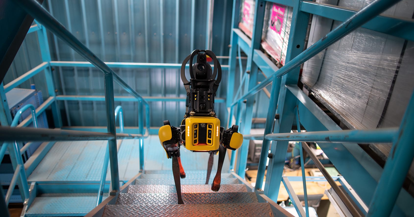 Boston Dynamics Spot mobile robot climbing industrial stairs
