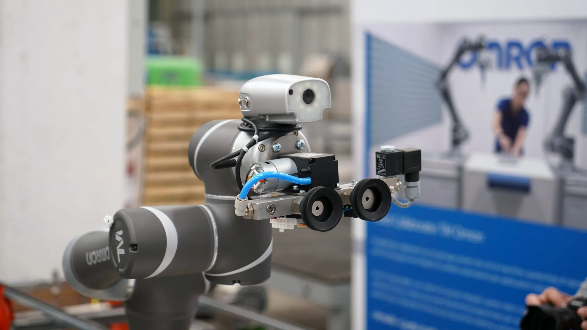 OMRON TM5-900 collaborative robot shown in a factory automation setting